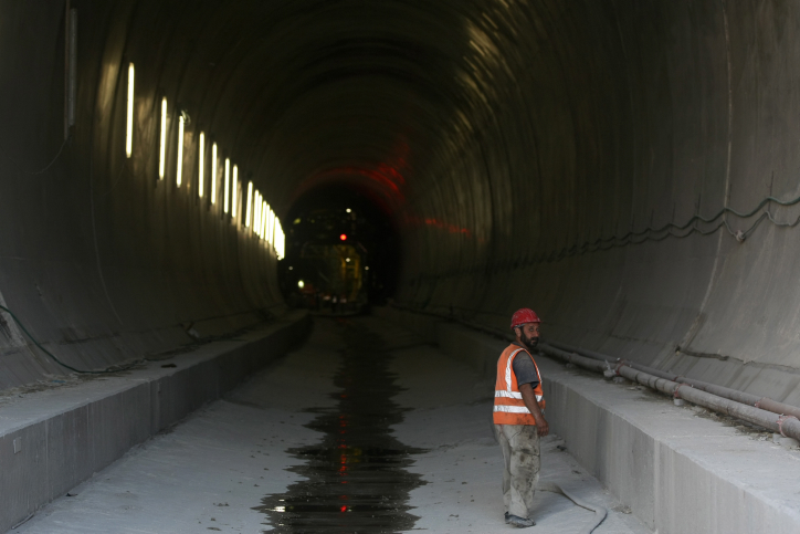 Construction worker walks in a tunnel along the route of the express train between Tel Aviv and Jerusalem, on November 01, 2011. Speed ??railway line between Tel Aviv and Jerusalem, scheduled to open in 2017 with an investment of about 7 billion NIS. The line will travel from the capital to Tel Aviv in less than half an hour. Tracks, 60 km long, will contain several large infrastructure projects in Israel, including 22 km of underground tunnels. and construction of the country's longest bridge (Bridge #6 - 1.25 km long and 60 meter height). Photo by Kobi Gideon / Flash90. *** Local Caption *** ?????? ???? ?? ???? ?? ???????? ?????? ??????? ???? ?????