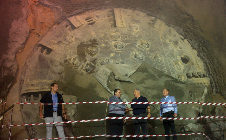 Israeli prime minister Benjamin Netanyahu (2R) and Minister of Transportation Israel Katz (2L) seen inside a tunnel along the route of the express train between Jerusalem and Tel Aviv, on October 6, 2014. Speed ??railway line between Tel Aviv and Jerusalem, scheduled to open in 2017 with an investment of about 7 billion NIS. The line will travel from the capital to Tel Aviv in less than half an hour. Tracks, 60 km long, will contain several large infrastructure projects in Israel, including 22 km of underground tunnels. and construction of the country's longest bridge (Bridge #6 - 1.25 km long and 60 meter height). Photo by Haim Zach/GPO *** Local Caption *** ?????? ???? ?? ???? ?? ???????? ?????? ??????? ???? ????? ??? ?????? ?????? ?????? ??? ??????? ????? ?? ?????? ?????? ????? ?????? ??? ??????? ??? ????