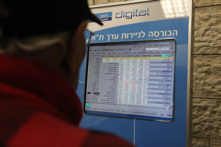 People are looking at a Stock Exchange screen in a Bank at the center of Jerusalem on Jan 16 2011 Pro-Palestinian hackers brought down the websites of the Tel Aviv Stock Exchange and Israel's El Al international airline Monday. The latest attack seems part of an ongoing cyber offensive against Israel. Photo by Yossi Zamir/Flash 90 *** Local Caption *** ????? ????? ???? ????? ??? ??? ?????