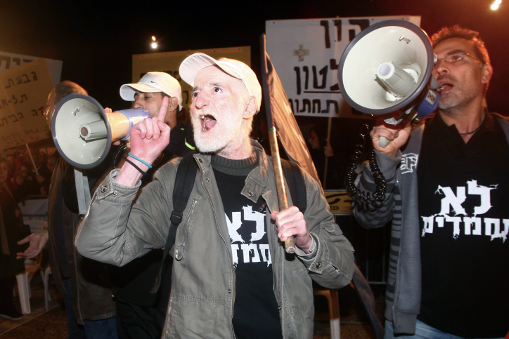 Israelis take part in a protest against soaring prices of living in Tel Aviv's Rabin Square on January 18, 2014. Photo by Roni Schutzer/Flash90 *** Local Caption *** . ???? ????? ?? ?????? ???? ???? ????? ??? ?????